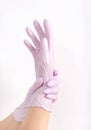 Woman hand in pink glove , copy space light Royalty Free Stock Photo