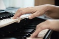 Woman hand play electone keyboard