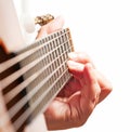 Woman hand playing guitar