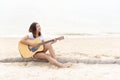 Woman hand playing guitar on the beach. Acoustic musician playing  classic guitar. Musical Concept Royalty Free Stock Photo