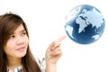 Woman hand pointing earth globe.