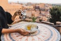 Woman hand pouring traditional moroccan mint tea in glasses. Morocco hospitality Royalty Free Stock Photo