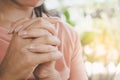 Woman hand praying peacefully outdoors