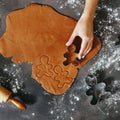 Woman hand cooking Christmas cookies ginger men top view Royalty Free Stock Photo