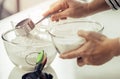 Woman hand preparing flour for Bakery ingredient mixing into glass bowl