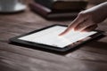 Woman hand presses on screen digital tablet