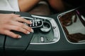 Woman hand pressing on button in vehicle Royalty Free Stock Photo