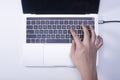 Woman hand pressing keyboard shortcut on laptop keyboard