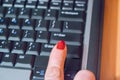 Woman hand pressing `shift` button on computer