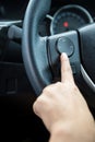 A woman hand pushes the volume control button Royalty Free Stock Photo