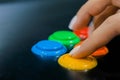 Woman hand pushing bright buttons on retro arcade game machine - close up view Royalty Free Stock Photo