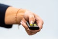 Woman hand pushing button on remote control car key, close-up Royalty Free Stock Photo