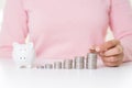 Woman hand putting money coin on stack of coins Royalty Free Stock Photo