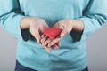 Woman hand red heart