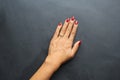Woman hand red nail polish wearing diamond ring photo stock photo Royalty Free Stock Photo