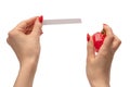 Woman hand with red nails with test strips for the perfume, isolated on a white background Royalty Free Stock Photo