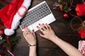 Woman hand with red nails tiping on laptop Royalty Free Stock Photo