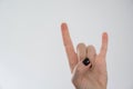 woman hand in rock and roll gesture sign Royalty Free Stock Photo