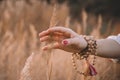 Woman hand running through wheat field. Girl`s hand touching yellow wheat ears closeup. Harvest concept. Harvesting Royalty Free Stock Photo