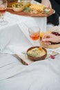 Woman hand scooping hummus with a spoon. Royalty Free Stock Photo