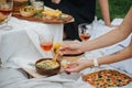 Woman hand scooping hummus with a spoon. Royalty Free Stock Photo