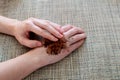 Woman hand with scrub coffee grounds on table