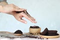 Woman hand with scrub coffee grounds on wooden background, Beauty and healthy care concept Royalty Free Stock Photo