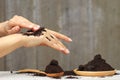 Woman hand with scrub coffee grounds on wooden background, Beauty and healthy care concept