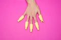 A woman hand with set of plastic women nail art soak off cap clip UV gel polish remover wrap tool for home shellac nail