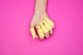 A woman hand with set of plastic women nail art soak off cap clip UV gel polish remover wrap tool for home shellac nail