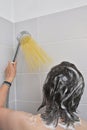 Woman Hand With Silver Shower and Pasta Spaghetti like Water Jet