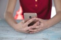 Woman hand smart phone in table