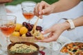 Woman hand smearing hummus on bread with a spoon. Royalty Free Stock Photo