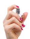 Woman hand spraying perfume