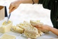 woman hand spreads bread with cheese salad with garlic. the process of preparing a snack for a grill party Royalty Free Stock Photo