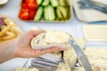 woman hand spreads bread with cheese salad with garlic. the process of preparing a snack for a grill party Royalty Free Stock Photo