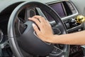 Woman hand on a steering wheel and honking a horn with her right hand. Royalty Free Stock Photo