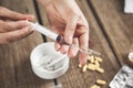 Woman hand syringe with drug and cigarettes