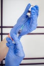 Woman hand with syringe, hypodermic needles and dermal liquid lift Royalty Free Stock Photo