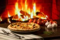 Woman hand take slice of Pizza over fireplace background with tomatoes Royalty Free Stock Photo