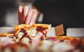 Woman Hand takes a slice of chicken Pizza in paper box Royalty Free Stock Photo