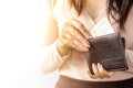 Woman hand taking money from black purse for payment Royalty Free Stock Photo