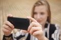 Woman hand taking photo of the city with a smartphone. Close up of woman`s hands. Cell phone. Telephone. Mobility and Royalty Free Stock Photo