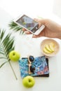 Woman hand taking summer pictures while eataing nutritious breakfast. Photography concept.