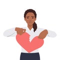 woman hand tearing apart a paper heart. broken heart and sad emotionally Royalty Free Stock Photo