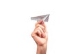 Woman hand throwing origami plane isolated on white background. Handmade flying paper construction. Optimism, childhood Royalty Free Stock Photo