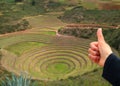 Woman Hand Thumbs Up on the Archaeological site of Moray, the Inca agricultural terraces in Cusco region, Peru