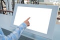 Woman hand touching interactive white touchscreen display kiosk: close up Royalty Free Stock Photo