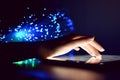 Woman Hand Touching Tablet Screen Browsing Internet On Blurry Fiber Optic Bokeh Background Technology Concept Close Up Royalty Free Stock Photo