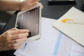 Woman hand Trading online on tablet with business paper and coffee Royalty Free Stock Photo